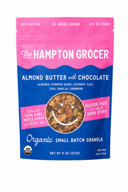 The Hampton Grocer organic small batch granola packaging with a pink and blue design.
