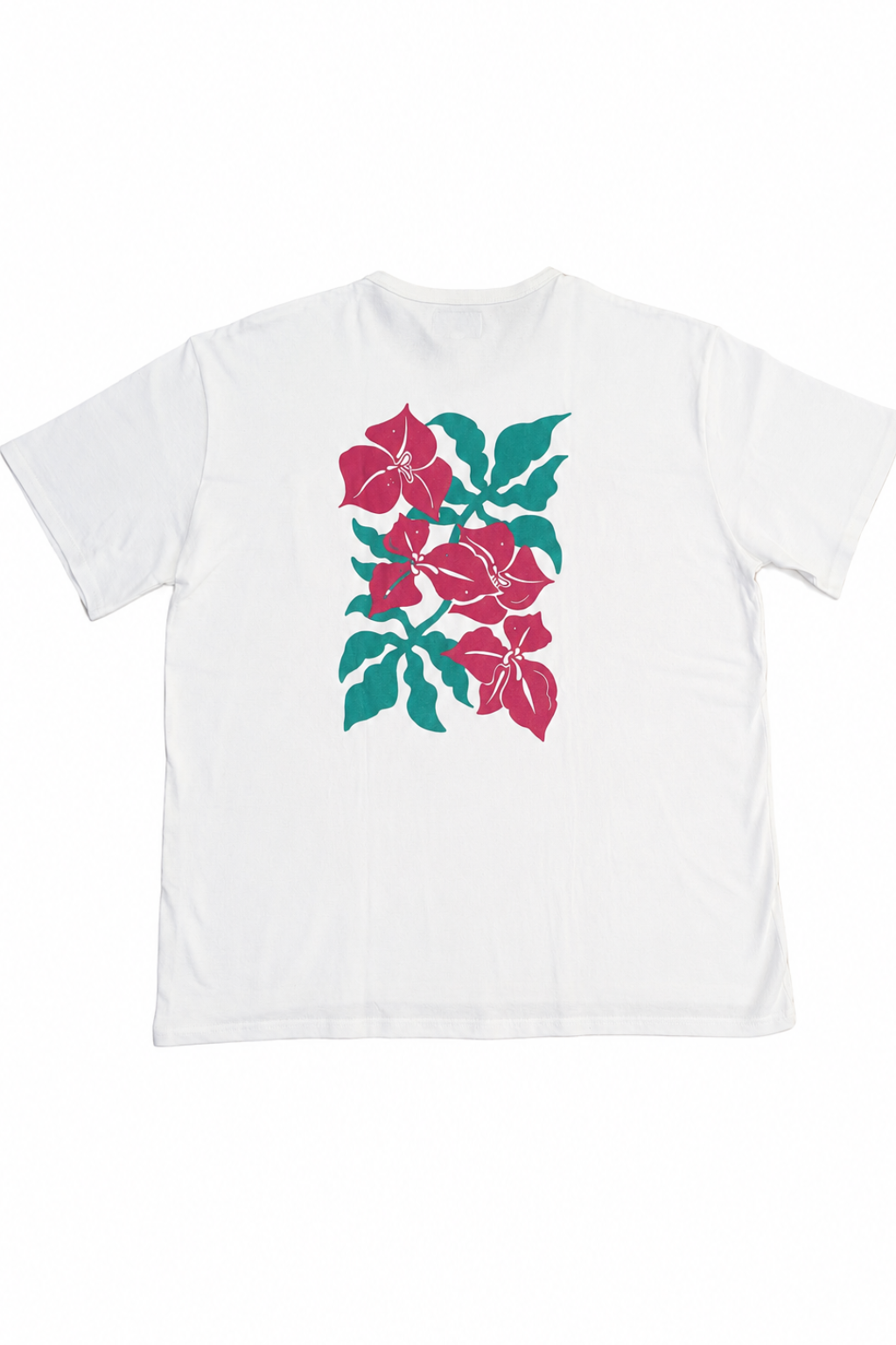 A white short-sleeve crewneck t-shirt featuring a graphic print of pink hibiscus flowers and teal leaves on the front, displayed against a solid white background.